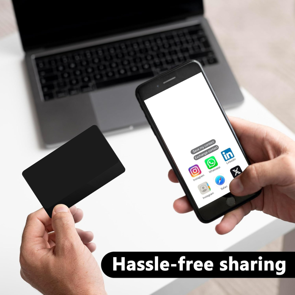 Person holding a premium matte black NFC tap business card and smartphone to demonstrate hassle-free sharing of contact details, social media profiles, and websites. Designed for creators, entrepreneurs, car enthusiasts, and professionals who want instant networking without apps, QR codes, or paper cards. Durable metal construction, customizable engraving, and universal compatibility with iPhone and Android smartphones for quick tap-to-share functionality.